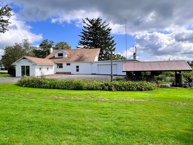 back of property featuring a lawn