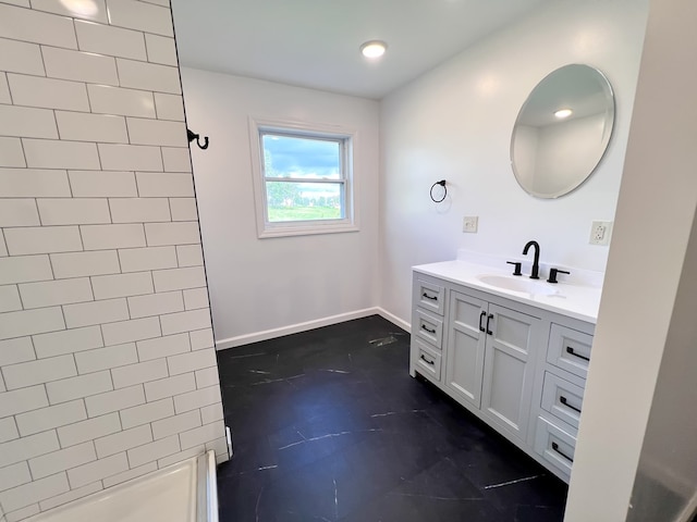 bathroom featuring vanity, recessed lighting, baseboards, and walk in shower