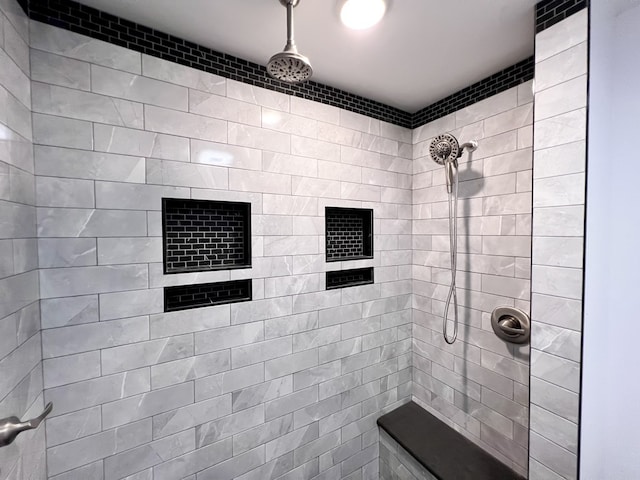 bathroom with a tile shower