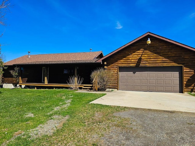108 Fred Catlin Rd, Owego, NY 13827 - view of front of home featuring log exterior, a front lawn, driveway, roof with shingles, and a garage