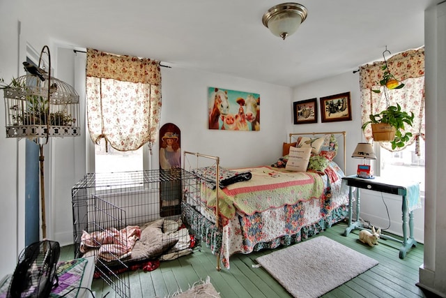 bedroom with hardwood / wood-style floors