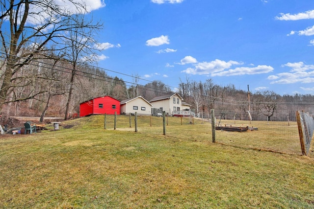 view of yard with a rural view and fence