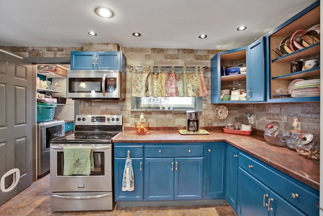 kitchen featuring blue cabinetry, appliances with stainless steel finishes, open shelves, and backsplash