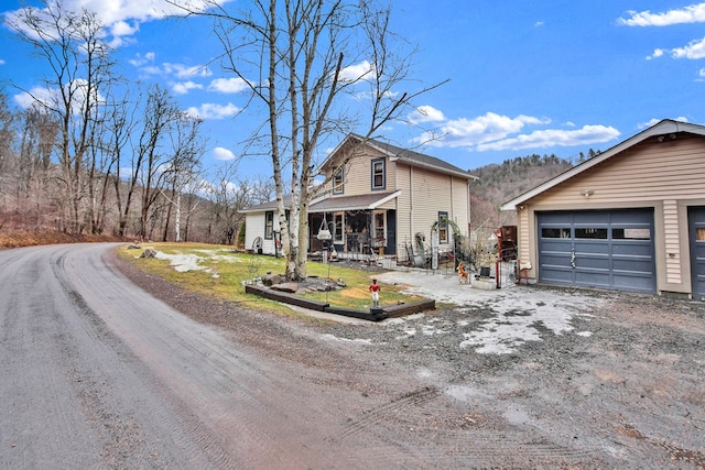 view of front of property with a garage and a porch