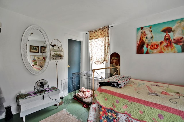 bedroom with wood finished floors