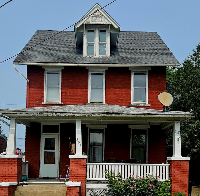 304 N Elmer Ave, Sayre, PA 18840 - traditional style home featuring a porch, brick siding, and a shingled roof