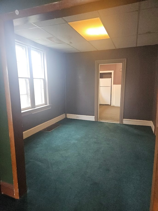 304 N Elmer Ave, Sayre, PA 18840 - carpeted empty room featuring a paneled ceiling