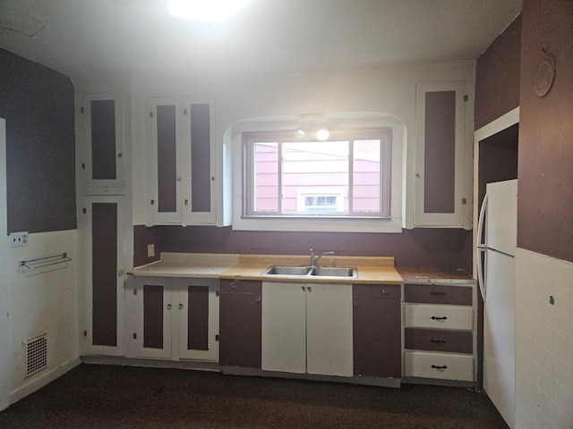 304 N Elmer Ave, Sayre, PA 18840 - kitchen featuring light countertops, freestanding refrigerator, and white cabinetry