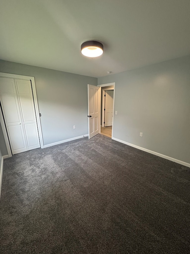 121 Park Pl, Waverly, NY 14892 - unfurnished bedroom with baseboards and dark carpet