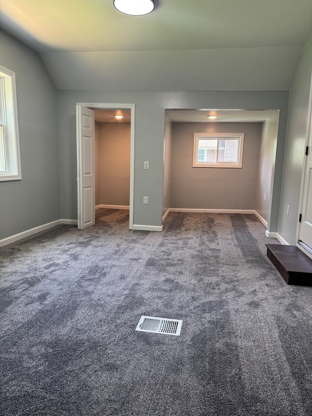 121 Park Pl, Waverly, NY 14892 - unfurnished bedroom featuring carpet floors and vaulted ceiling