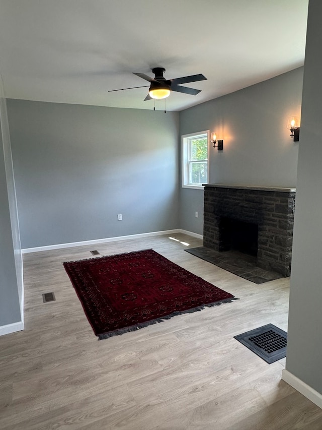 121 Park Pl, Waverly, NY 14892 - unfurnished living room with a ceiling fan, wood finished floors, and a fireplace with flush hearth