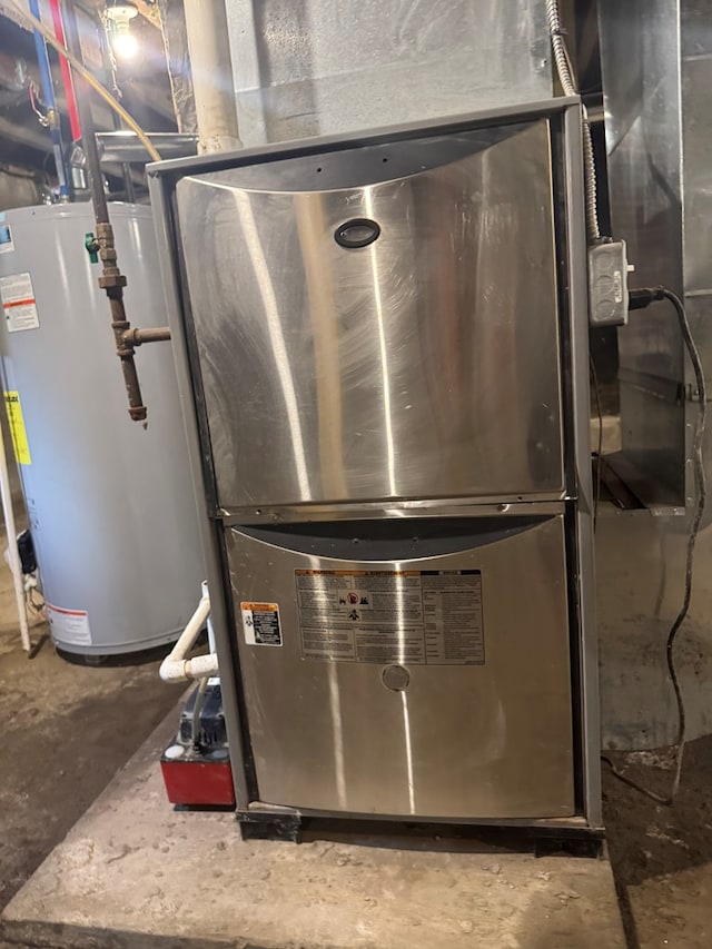 121 Park Pl, Waverly, NY 14892 - utility room featuring gas water heater and heating unit