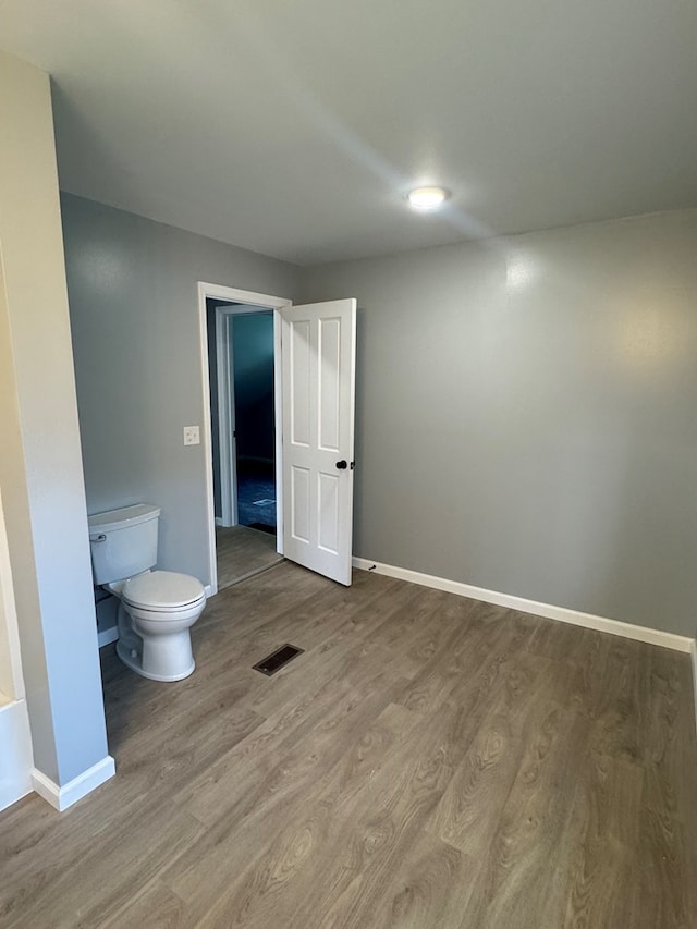 121 Park Pl, Waverly, NY 14892 - bathroom with toilet and wood finished floors