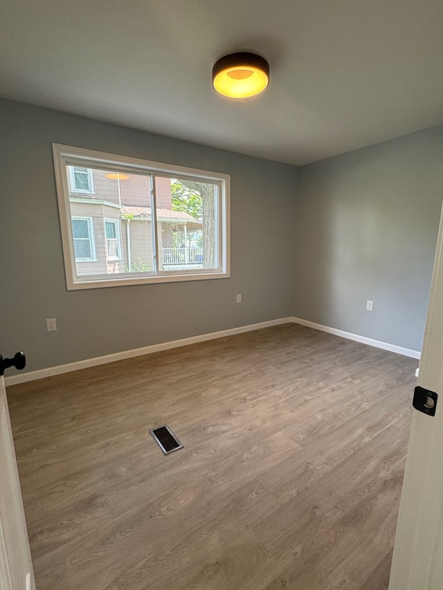 121 Park Pl, Waverly, NY 14892 - empty room featuring wood finished floors and baseboards