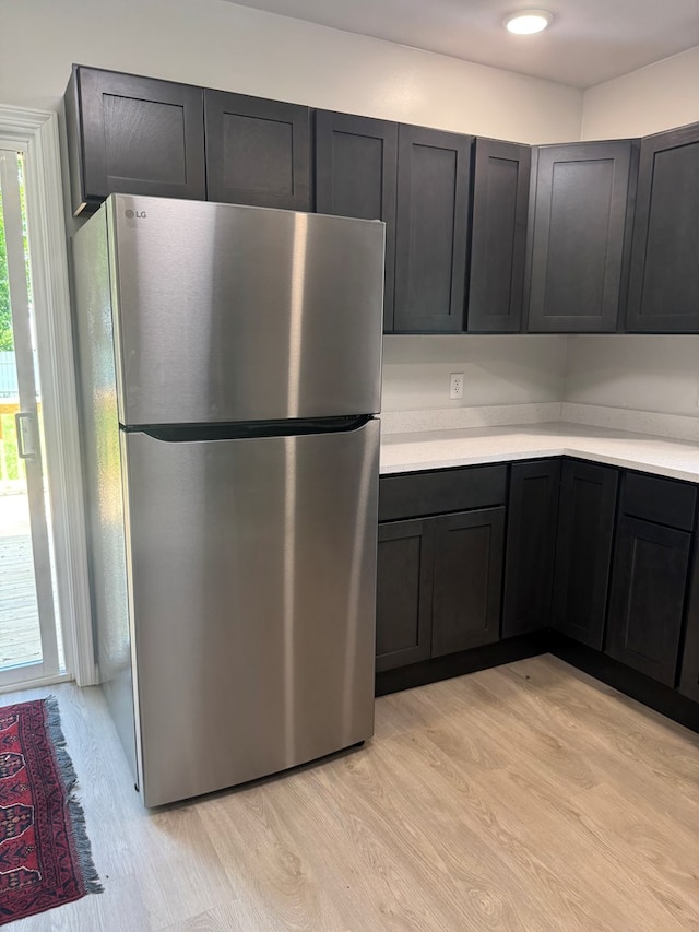 121 Park Pl, Waverly, NY 14892 - kitchen featuring freestanding refrigerator, light wood-style flooring, and light countertops