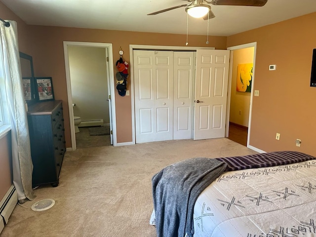 bedroom with carpet floors, a closet, ceiling fan, and a baseboard heating unit