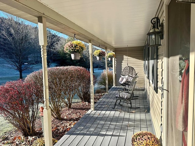 wooden deck featuring covered porch