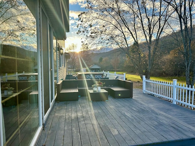 wooden deck with an outdoor living space