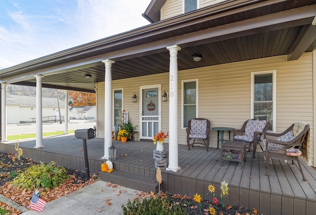 wooden terrace featuring a porch