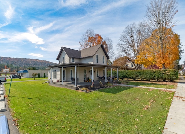 view of property exterior featuring a porch and a lawn