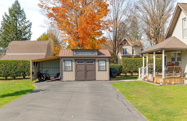 exterior space with a yard and a carport