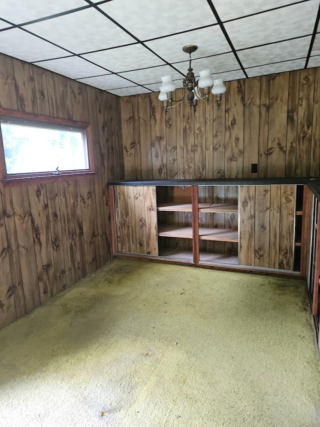 446 Pennsylvania Ave, Waverly, NY 14892 - interior space featuring wooden walls, a chandelier, and carpet flooring