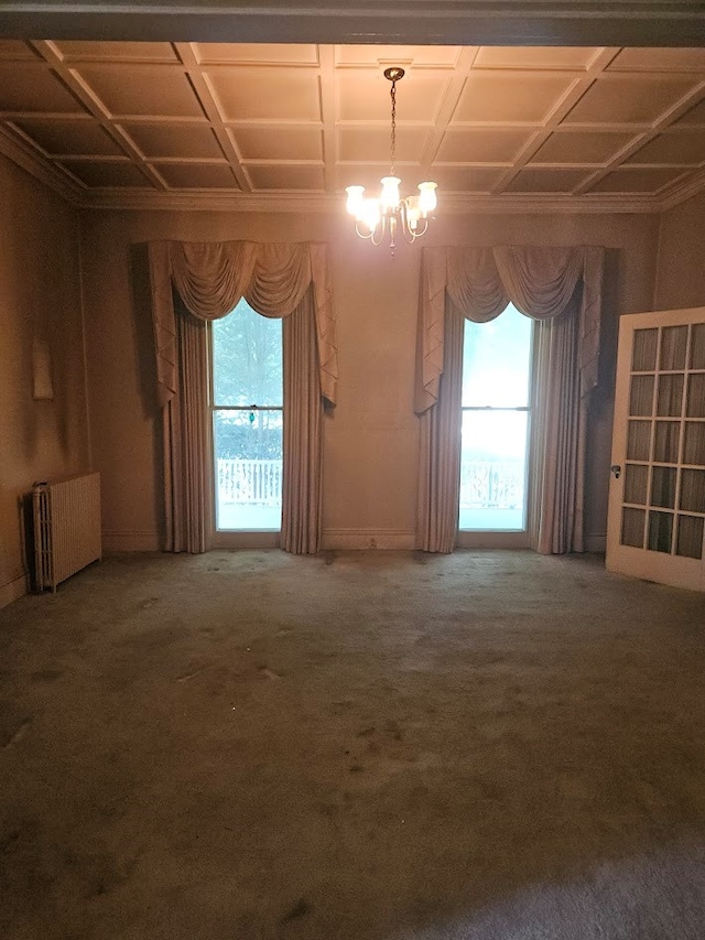446 Pennsylvania Ave, Waverly, NY 14892 - spare room with radiator heating unit, a chandelier, and carpet floors