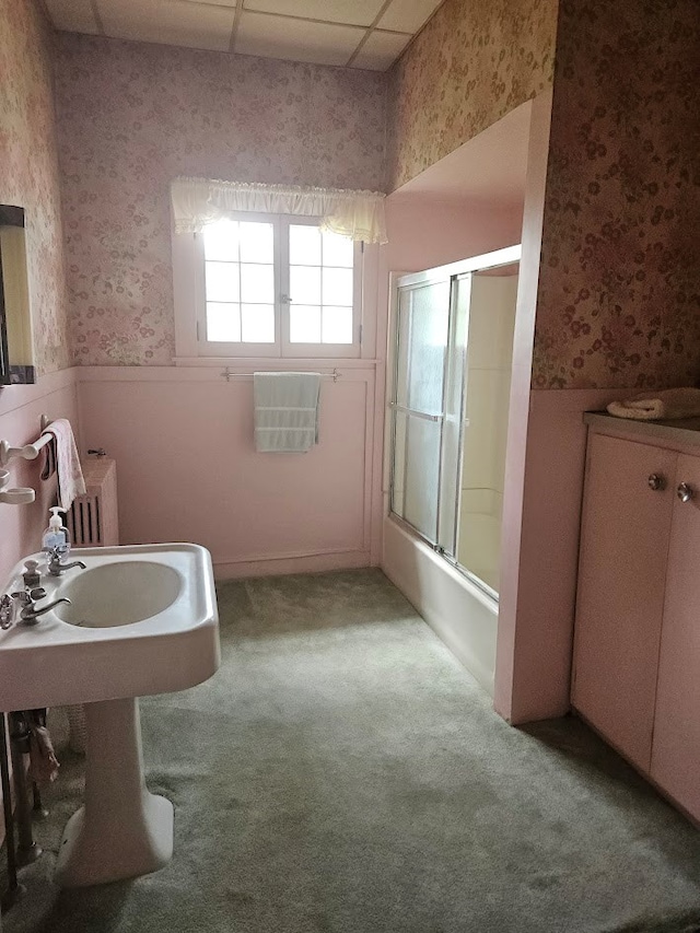 446 Pennsylvania Ave, Waverly, NY 14892 - bathroom featuring wallpapered walls, a wainscoted wall, combined bath / shower with glass door, and carpet floors