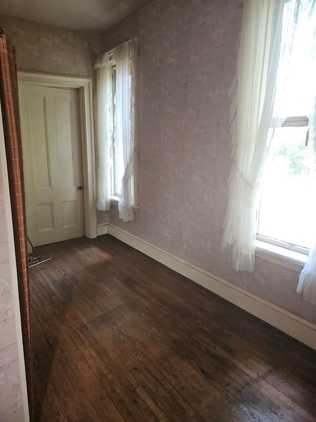 446 Pennsylvania Ave, Waverly, NY 14892 - unfurnished room featuring dark wood-style floors and baseboards