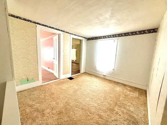 unfurnished bedroom with carpet