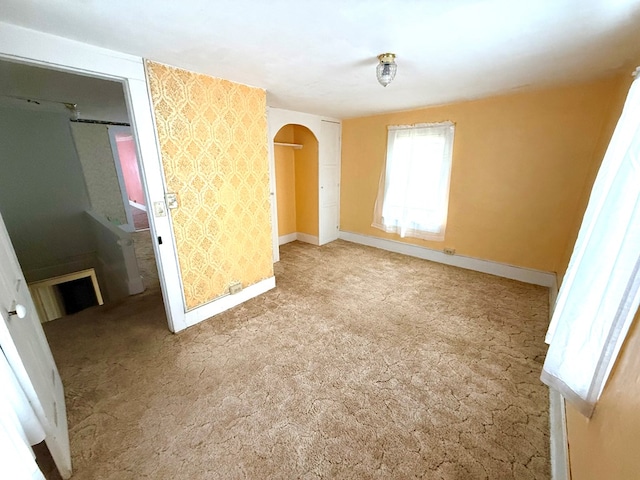 unfurnished bedroom with light carpet