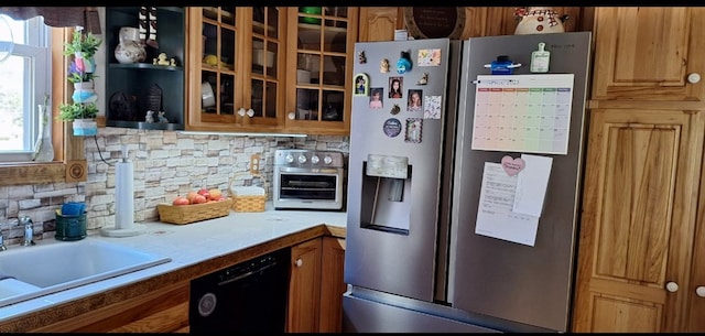 607 N W St, Coudersport, PA 16915 - kitchen with stainless steel fridge, black dishwasher, backsplash, a sink, and glass insert cabinets