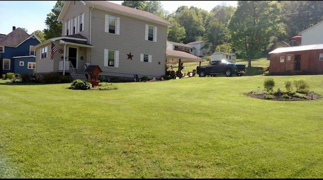 607 N W St, Coudersport, PA 16915 - rear view of house with a lawn