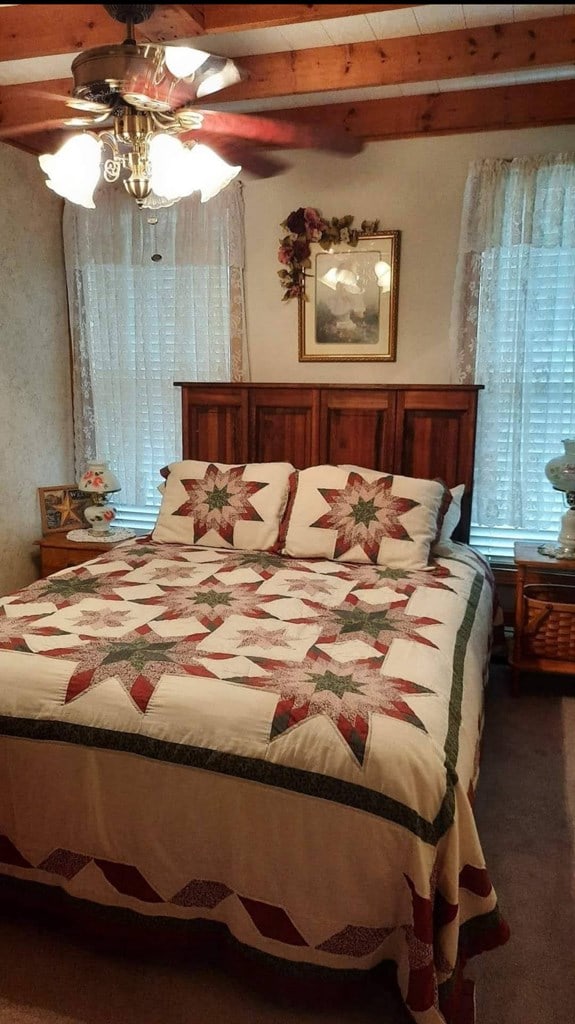 607 N W St, Coudersport, PA 16915 - bedroom with carpet flooring and beamed ceiling
