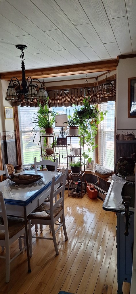607 N W St, Coudersport, PA 16915 - dining room with a chandelier, plenty of natural light, light wood-type flooring, and crown molding