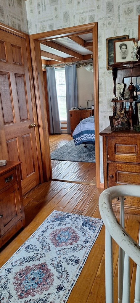 607 N W St, Coudersport, PA 16915 - bedroom with wallpapered walls and light wood-style floors