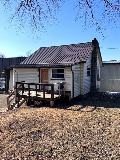 back of property with a deck