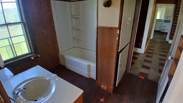 2323 Cotton Hollow Rd, Athens, PA 18810 - full bathroom with healthy amount of natural light, washtub / shower combination, wood finished floors, and vanity