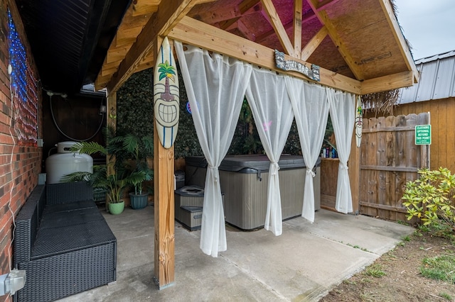 view of patio with a gazebo and a hot tub