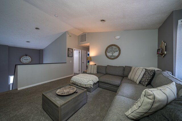 living room featuring vaulted ceiling, a textured ceiling, and dark colored carpet