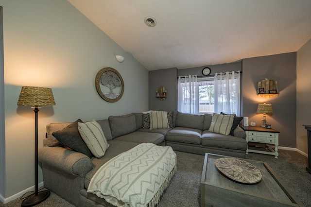 carpeted living room featuring vaulted ceiling