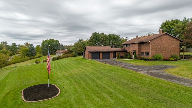 view of yard featuring a garage