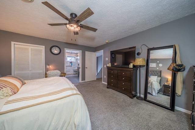 bedroom featuring ceiling fan, light colored carpet, a textured ceiling, and a closet