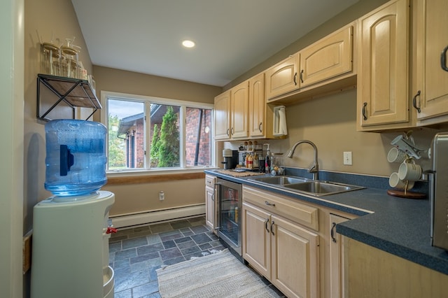 kitchen featuring light brown cabinetry, a baseboard radiator, beverage cooler, and sink