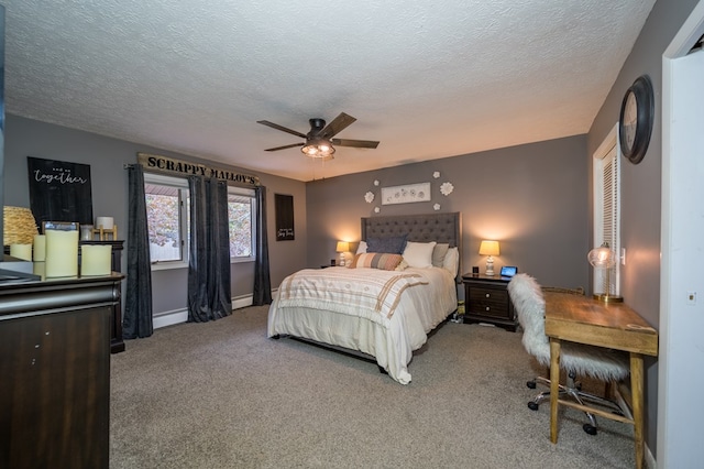 bedroom with ceiling fan, carpet floors, a textured ceiling, and a baseboard heating unit