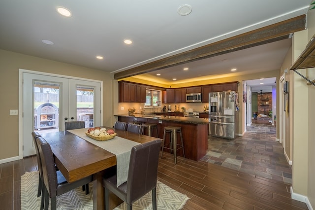 dining space with french doors and sink