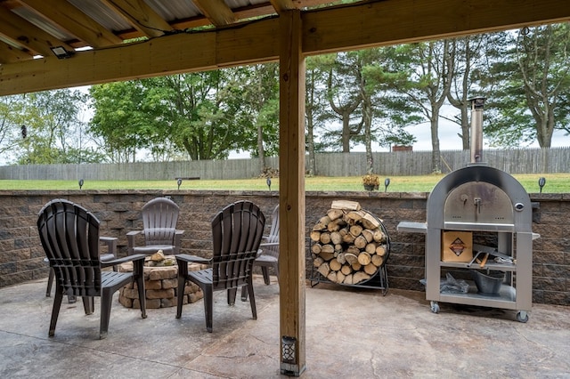 view of patio featuring a fire pit