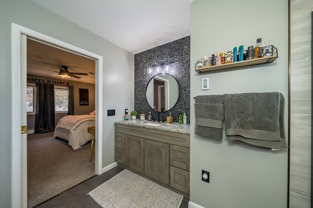 bathroom featuring ceiling fan, tile patterned flooring, and vanity