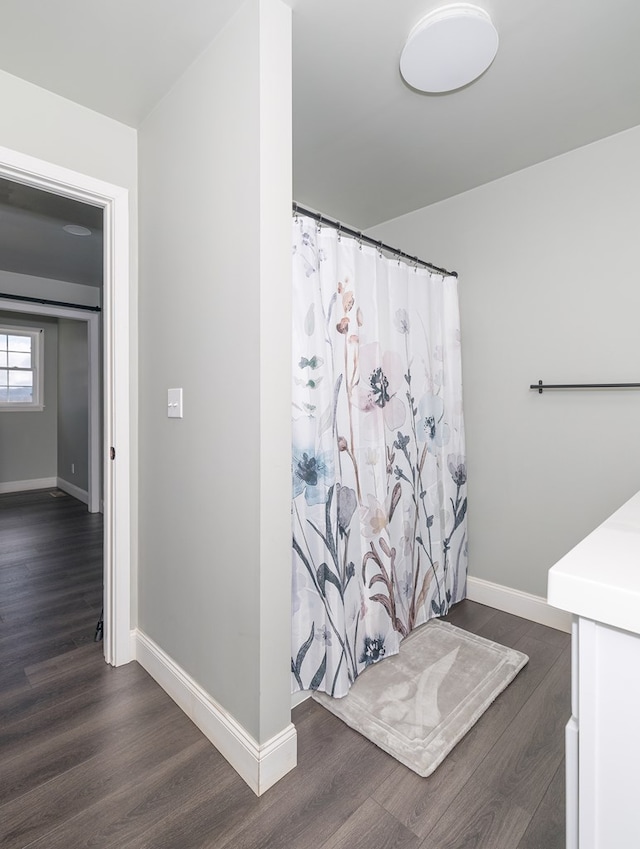 bathroom with vanity and wood-type flooring