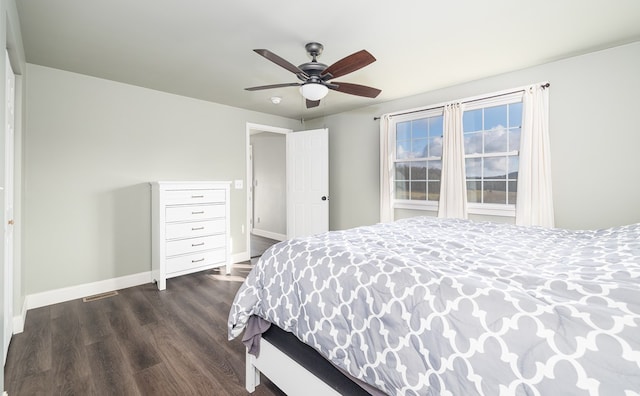 bedroom featuring ceiling fan and dark hardwood / wood-style floors